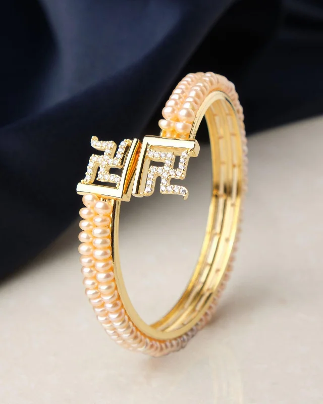 women’s bold bangles-Swastik Stone Studded Pearl Bangle